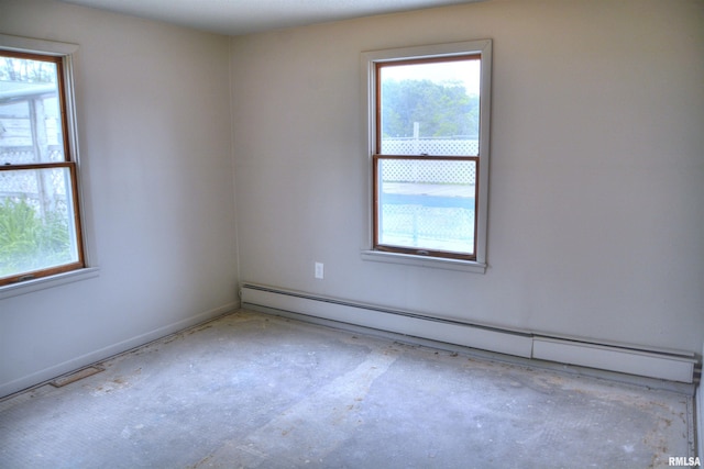 70 Constitution Rd, Colchester, IL 62326 - spare room featuring baseboard heating and healthy amount of natural light