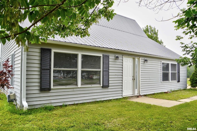 70 Constitution Rd, Colchester, IL 62326 - rear view of house with a yard and a metal roof