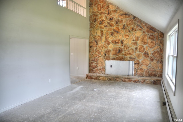 70 Constitution Rd, Colchester, IL 62326 - unfurnished living room featuring a baseboard heating unit and high vaulted ceiling