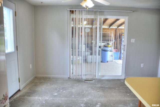 70 Constitution Rd, Colchester, IL 62326 - unfurnished room with ceiling fan and wooden walls
