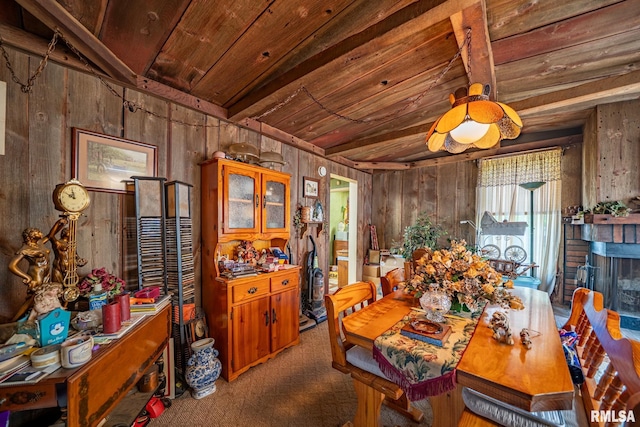 509 W Mcclure Ave, Peoria, IL 61604 - carpeted dining area featuring wood walls and wooden ceiling