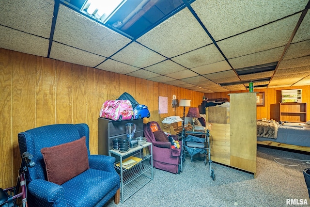 509 W Mcclure Ave, Peoria, IL 61604 - sitting room with wood walls, carpet, and a paneled ceiling