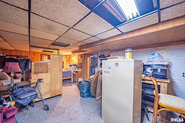 509 W Mcclure Ave, Peoria, IL 61604 - finished below grade area with refrigerator, wood walls, and carpet floors