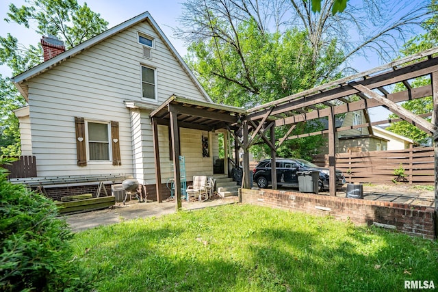 509 W Mcclure Ave, Peoria, IL 61604 - rear view of house with a chimney