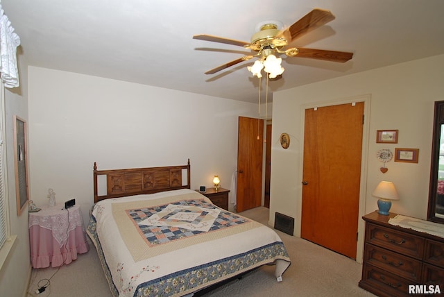 4 Alexander Ln, Bartonville, IL 61607 - carpeted bedroom with a ceiling fan