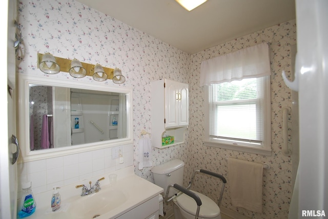 4 Alexander Ln, Bartonville, IL 61607 - bathroom with vanity, tasteful backsplash, and wallpapered walls