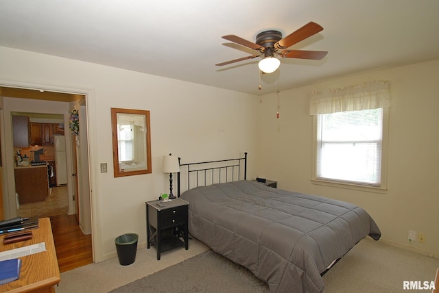 4 Alexander Ln, Bartonville, IL 61607 - carpeted bedroom with freestanding refrigerator and ceiling fan