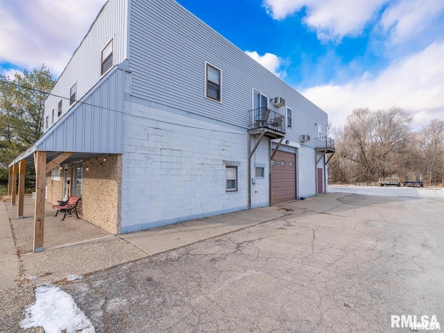3409 Meadow Ave Unit 61611, East Peoria, IL 61611 - view of side of property with a balcony and an attached garage