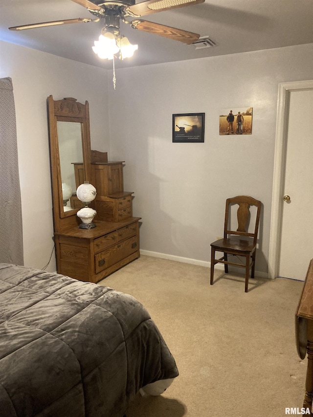 301 N Louise St, La Harpe, IL 61450 - bedroom featuring carpet and ceiling fan
