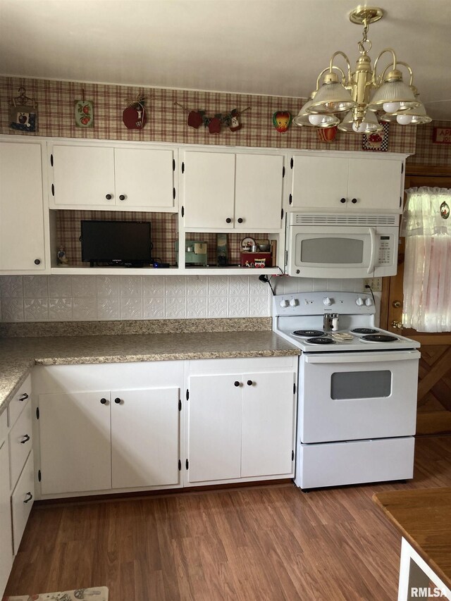 301 N Louise St, La Harpe, IL 61450 - kitchen featuring white appliances, white cabinetry, a chandelier, and dark wood-style floors