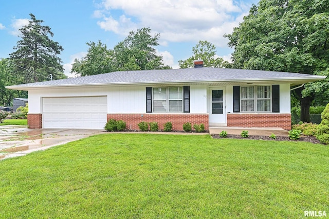 113 Highview Ter, East Peoria, IL 61611 - view of front facade with brick siding, an attached garage, driveway, and a front lawn