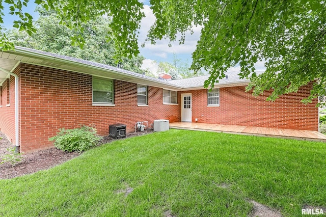 113 Highview Ter, East Peoria, IL 61611 - rear view of property with a lawn, brick siding, and a shingled roof