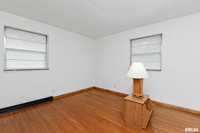113 Highview Ter, East Peoria, IL 61611 - empty room featuring hardwood / wood-style flooring and a baseboard radiator