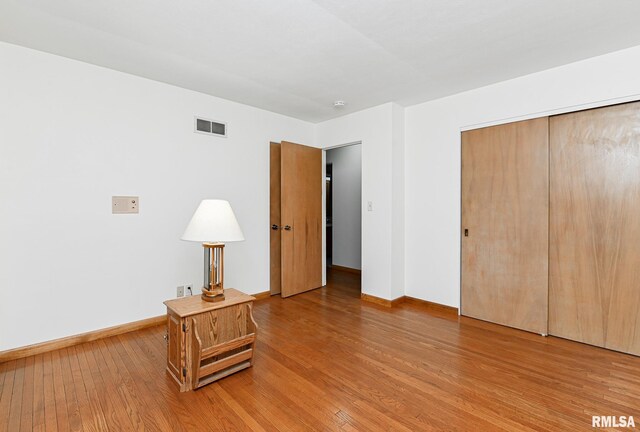 113 Highview Ter, East Peoria, IL 61611 - unfurnished bedroom with light wood-style flooring and a closet