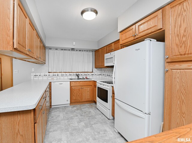 113 Highview Ter, East Peoria, IL 61611 - kitchen with white appliances, tasteful backsplash, light countertops, and brown cabinets