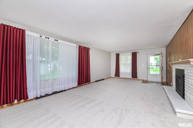 113 Highview Ter, East Peoria, IL 61611 - unfurnished living room with a fireplace and carpet