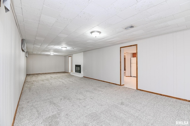 113 Highview Ter, East Peoria, IL 61611 - below grade area with carpet flooring, freestanding refrigerator, and a brick fireplace