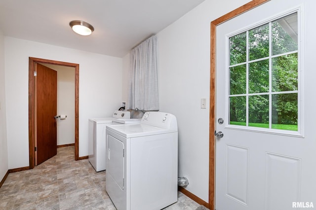 113 Highview Ter, East Peoria, IL 61611 - washroom with washer and dryer, healthy amount of natural light, stone finish flooring, and cabinet space