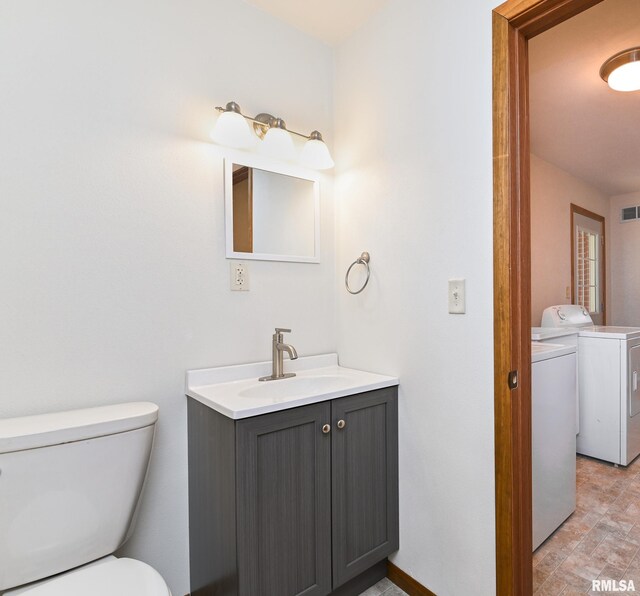 113 Highview Ter, East Peoria, IL 61611 - bathroom featuring separate washer and dryer and vanity