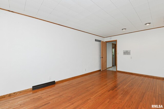 113 Highview Ter, East Peoria, IL 61611 - spare room featuring light wood-style flooring and crown molding