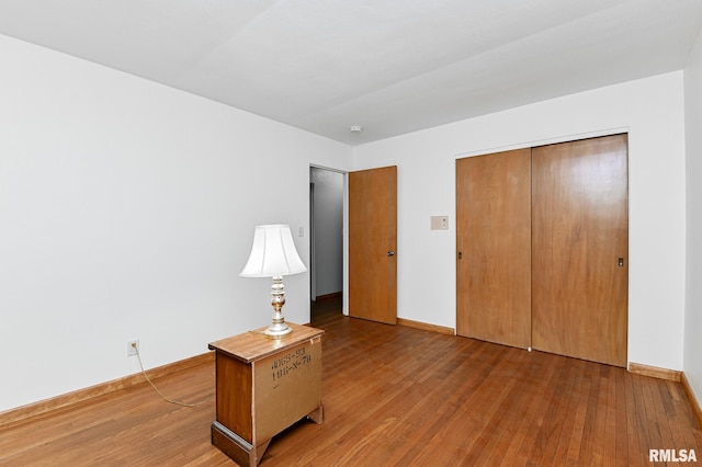 113 Highview Ter, East Peoria, IL 61611 - unfurnished bedroom with hardwood / wood-style flooring and a closet