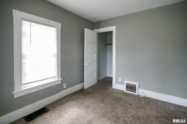 409 E Embert Pl, Peoria, IL 61603 - unfurnished bedroom featuring carpet flooring and baseboards