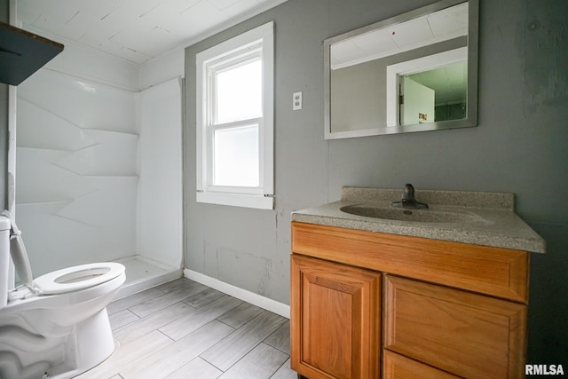409 E Embert Pl, Peoria, IL 61603 - bathroom featuring vanity, a shower stall, and wood finished floors