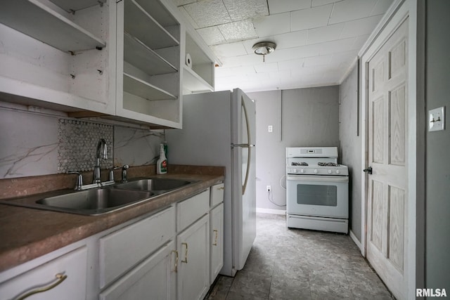 409 E Embert Pl, Peoria, IL 61603 - kitchen featuring white appliances, tasteful backsplash, white cabinetry, open shelves, and dark countertops