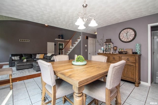116 Field Ct, East Peoria, IL 61611 - dining space with stairway, a chandelier, and light tile patterned flooring