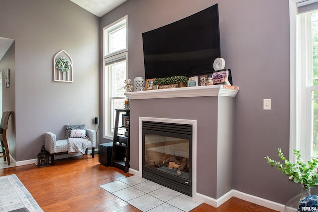 116 Field Ct, East Peoria, IL 61611 - living area featuring a glass covered fireplace and wood finished floors