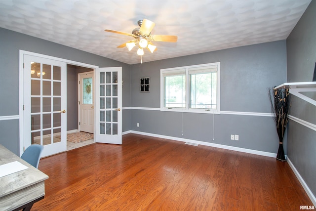 116 Field Ct, East Peoria, IL 61611 - unfurnished office with french doors, wood finished floors, and a ceiling fan