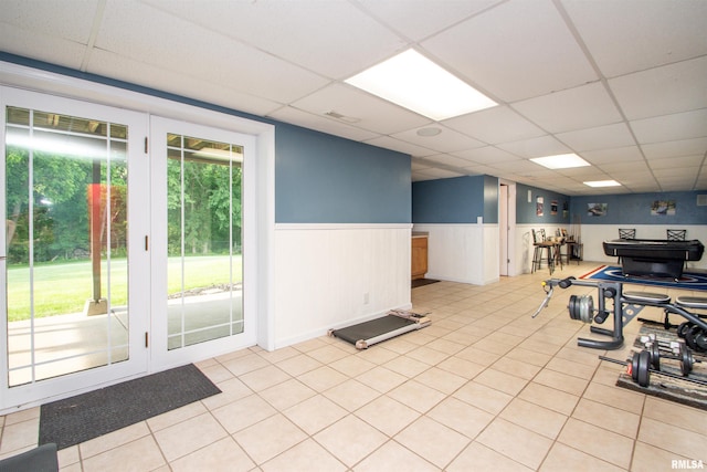 116 Field Ct, East Peoria, IL 61611 - exercise room featuring a drop ceiling, a wainscoted wall, and light tile patterned floors