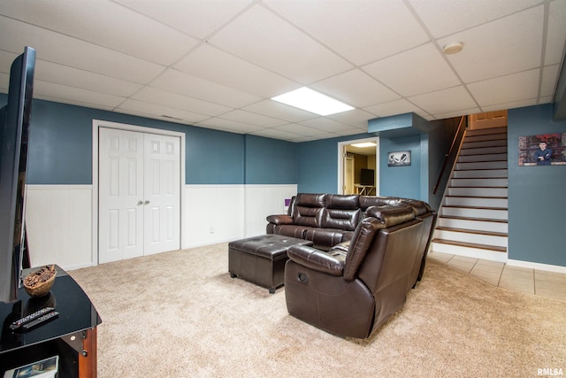 116 Field Ct, East Peoria, IL 61611 - living room featuring carpet flooring, a paneled ceiling, stairway, and a wainscoted wall