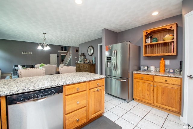 116 Field Ct, East Peoria, IL 61611 - kitchen featuring appliances with stainless steel finishes, light tile patterned flooring, light stone counters, pendant lighting, and recessed lighting