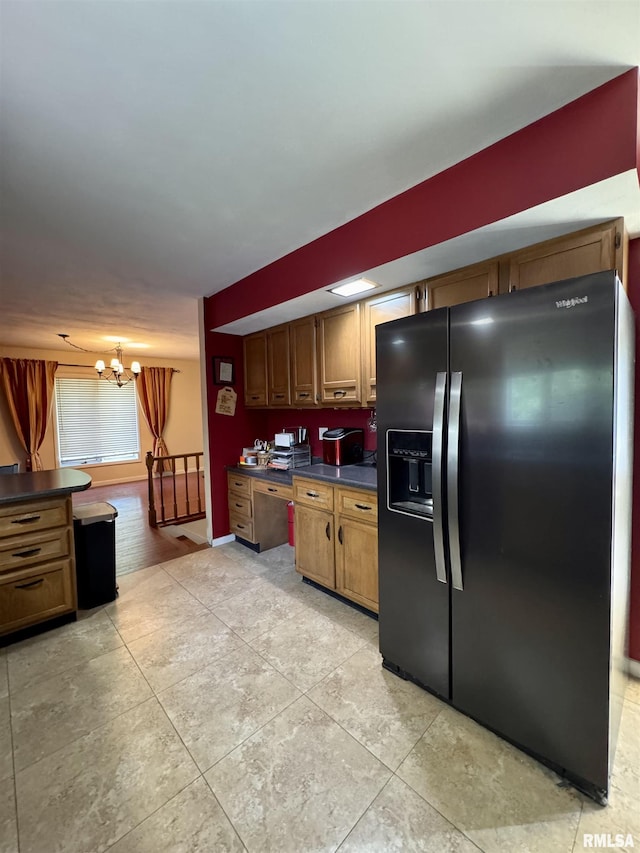 15 Elmo Dr, Macomb, IL 61455 - kitchen with black refrigerator with ice dispenser, dark countertops, a chandelier, and brown cabinetry