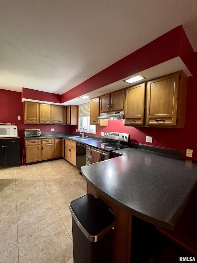 15 Elmo Dr, Macomb, IL 61455 - kitchen with under cabinet range hood, stainless steel electric range, dishwasher, white microwave, and dark countertops