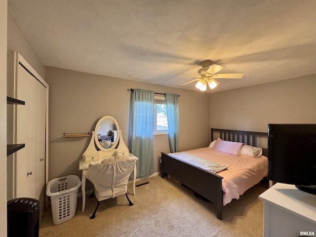 15 Elmo Dr, Macomb, IL 61455 - bedroom featuring a closet, light colored carpet, and ceiling fan
