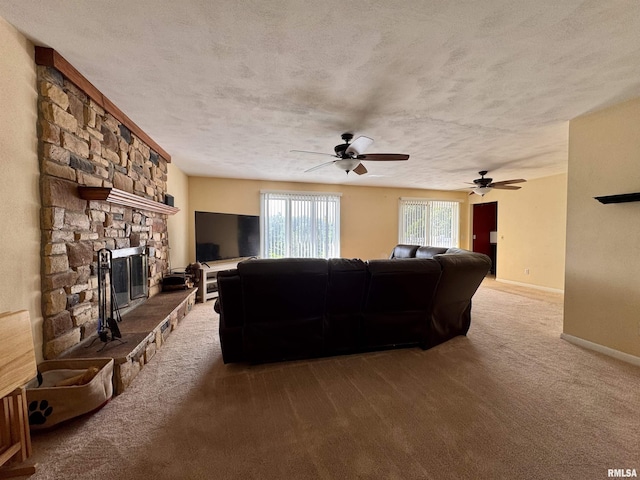 15 Elmo Dr, Macomb, IL 61455 - living area with a fireplace, carpet floors, ceiling fan, and a textured ceiling