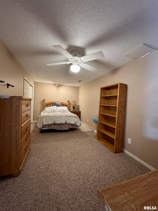15 Elmo Dr, Macomb, IL 61455 - carpeted bedroom with a textured ceiling and ceiling fan