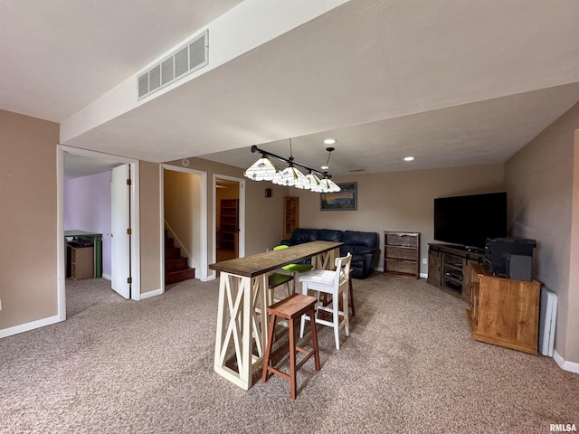 15 Elmo Dr, Macomb, IL 61455 - dining space featuring carpet and stairway