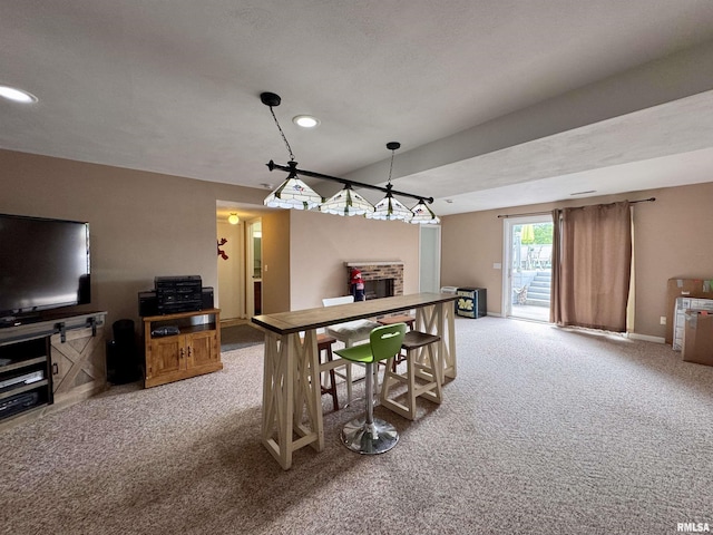 15 Elmo Dr, Macomb, IL 61455 - dining space featuring carpet floors, a fireplace, and recessed lighting