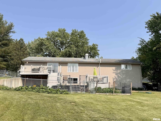 15 Elmo Dr, Macomb, IL 61455 - back of property featuring a wooden deck and a chimney