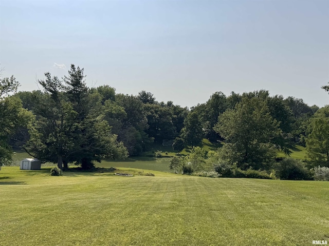 15 Elmo Dr, Macomb, IL 61455 - view of grassy yard featuring a storage shed