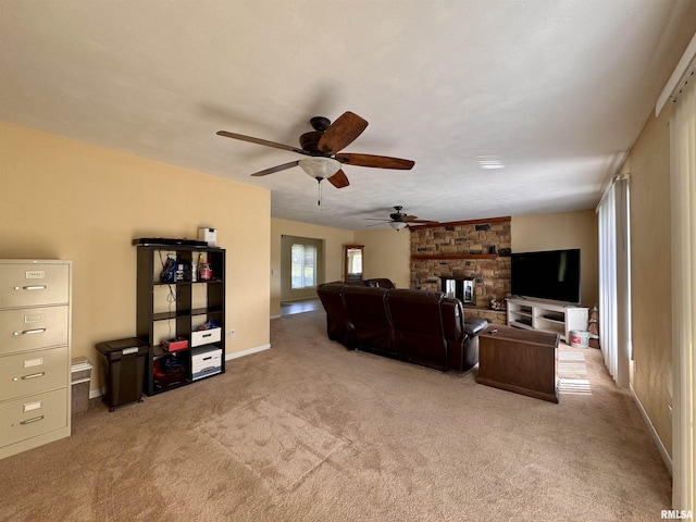 15 Elmo Dr, Macomb, IL 61455 - carpeted living room featuring ceiling fan and a fireplace