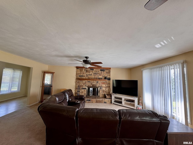 15 Elmo Dr, Macomb, IL 61455 - carpeted living room featuring a ceiling fan, a textured ceiling, and a fireplace