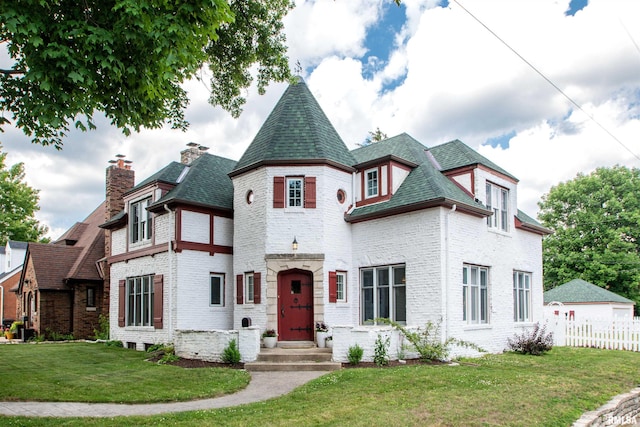 3316 N Biltmore Ave, Peoria, IL 61604 - view of front facade featuring brick siding, a chimney, and roof with shingles
