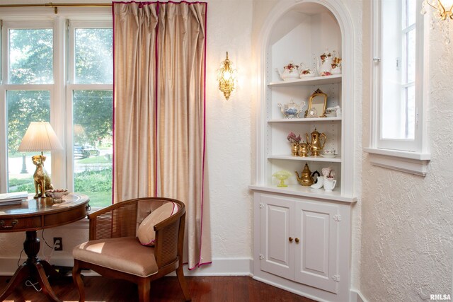 3316 N Biltmore Ave, Peoria, IL 61604 - sitting room featuring a textured wall and dark wood-style floors
