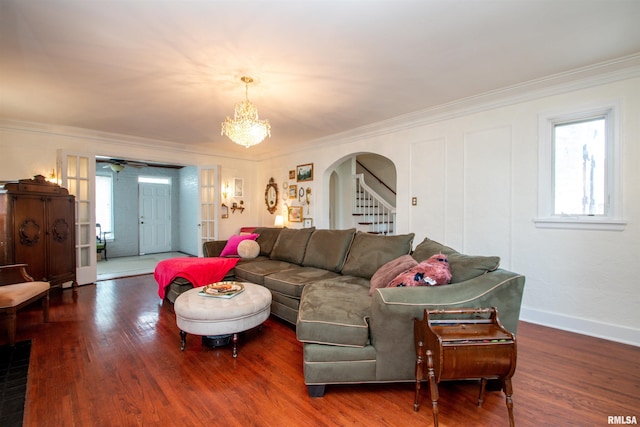 3316 N Biltmore Ave, Peoria, IL 61604 - living room with arched walkways, crown molding, healthy amount of natural light, wood finished floors, and a chandelier