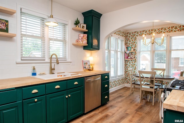 3316 N Biltmore Ave, Peoria, IL 61604 - kitchen with appliances with stainless steel finishes, open shelves, wooden counters, a chandelier, and healthy amount of natural light