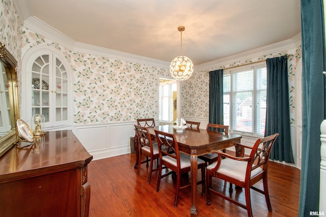 3316 N Biltmore Ave, Peoria, IL 61604 - dining space with wallpapered walls, wainscoting, crown molding, a chandelier, and dark wood-style floors